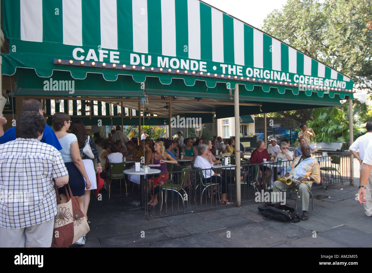 Customers eat and drink coffee at the famous Cafe du Monde in