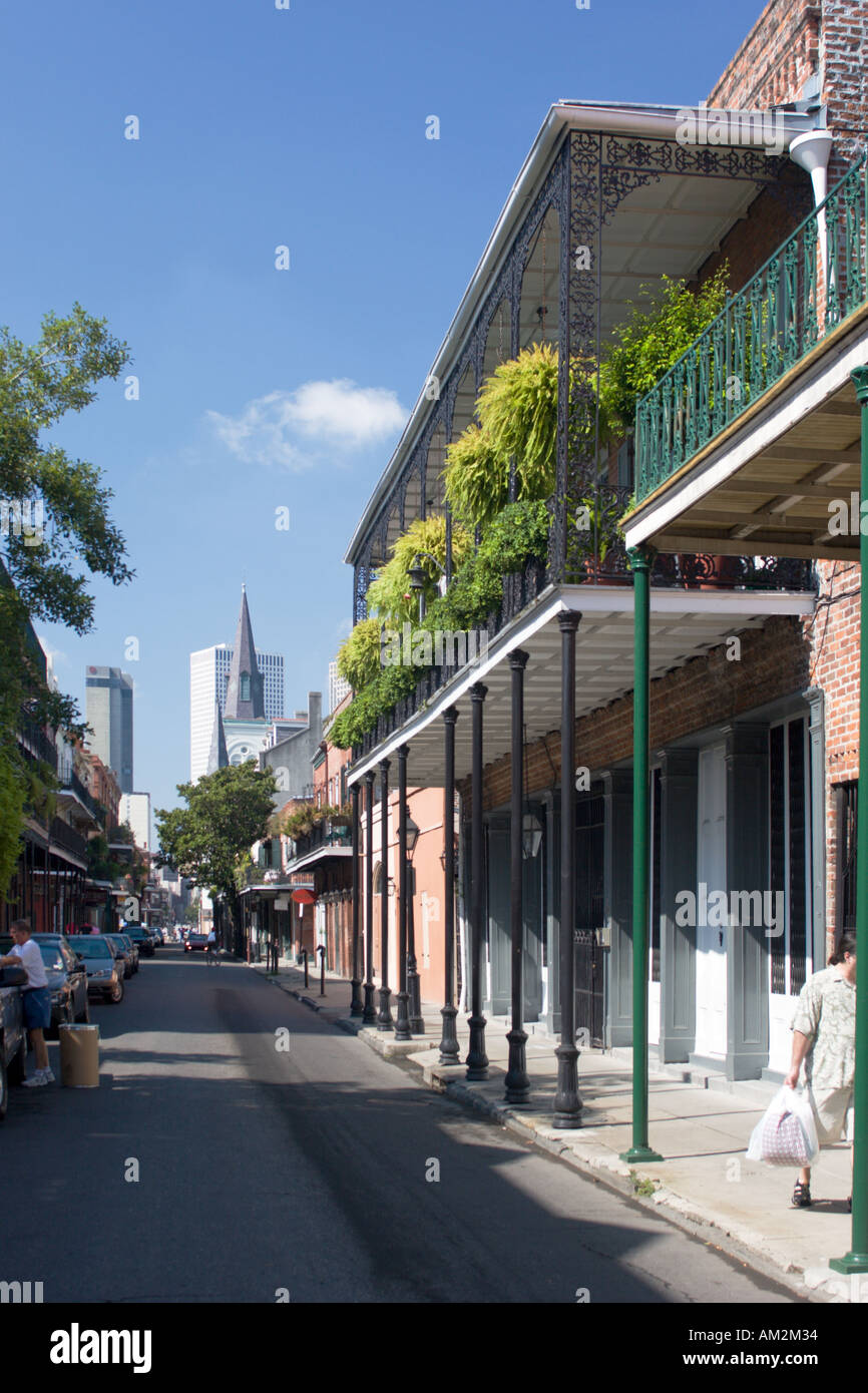 Wrought iron balconies with hanging plants on Chartres Street in the