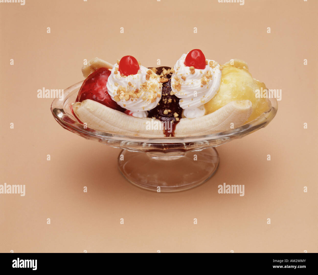 banana split ice cream sundae three scoop glass dish vanilla strawberry pineapple sauce whipped Photo - Alamy