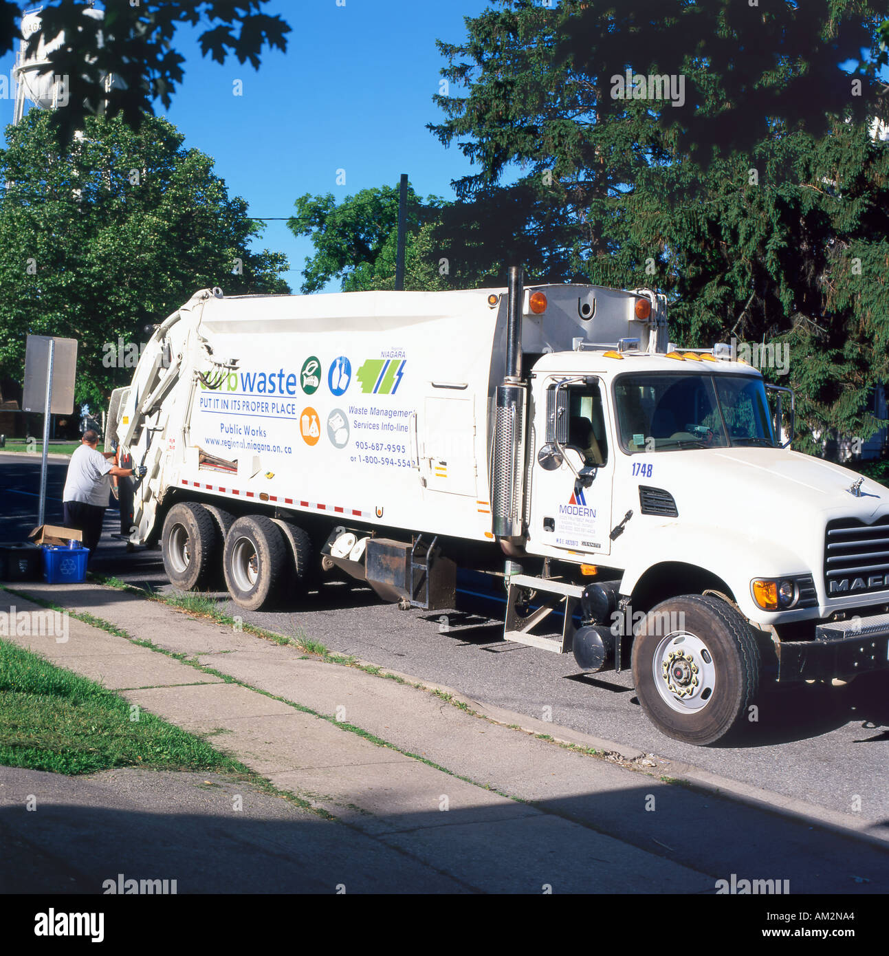 Curb side waste collection truck Fort Erie Ontario Canada  KATHY DEWITT Stock Photo