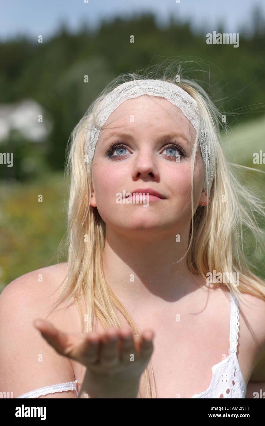 headshot pretty young girl playing outside in the nature summer breeze Stock Photo