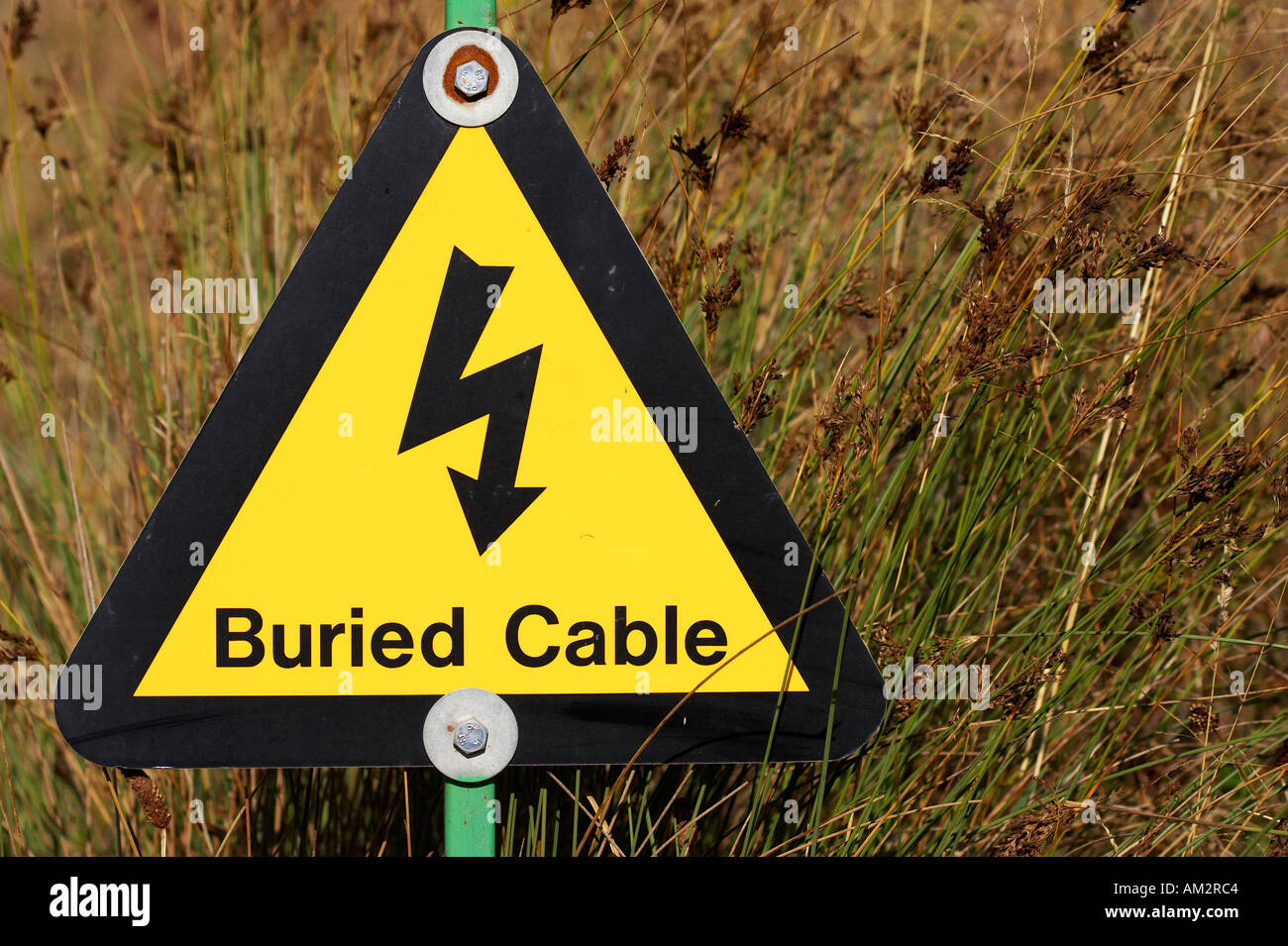 Yellow buried electrical cable warning sign at a quarry in the west midlands england uk Stock Photo