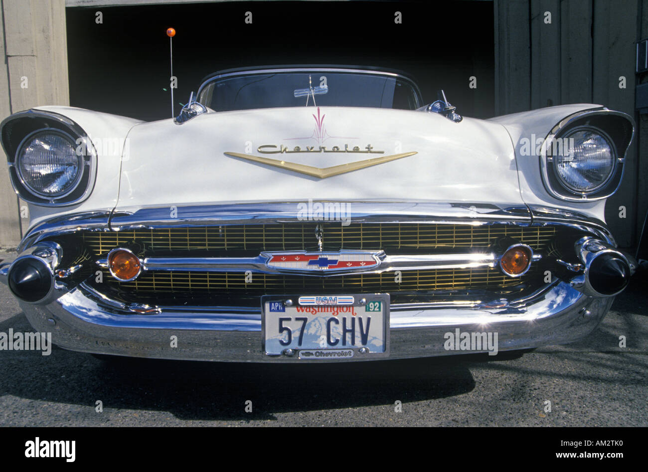 A white 1957 Chevrolet convertible with a Washington license plate reading 57 CHV Stock Photo