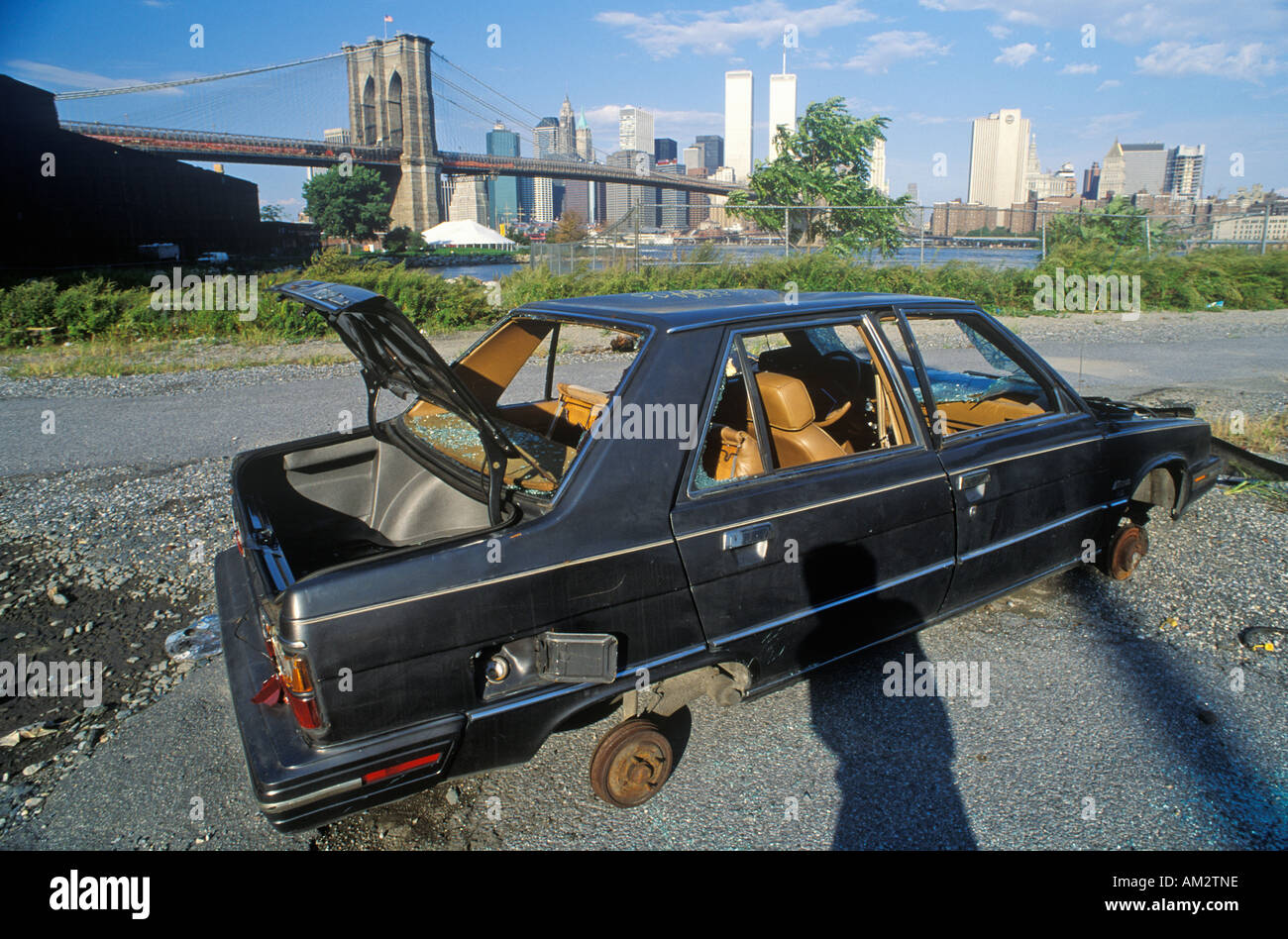 An abandoned stripped Volvo automobile near the Brooklyn Bridge in Brooklyn Stock Photo
