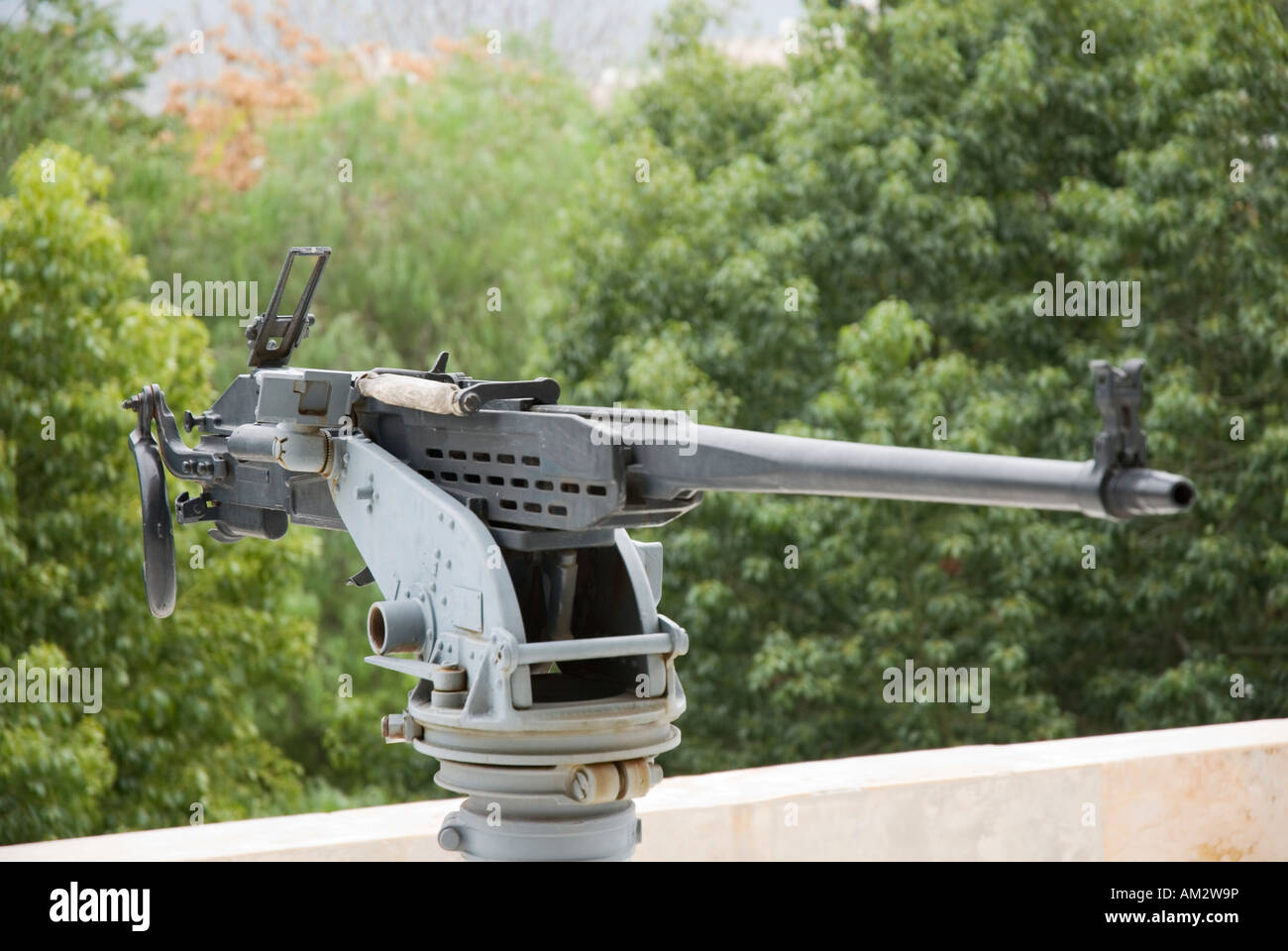 Heavy machine gun mounted on wall outside the Greek Hellenic War Museum. Stock Photo