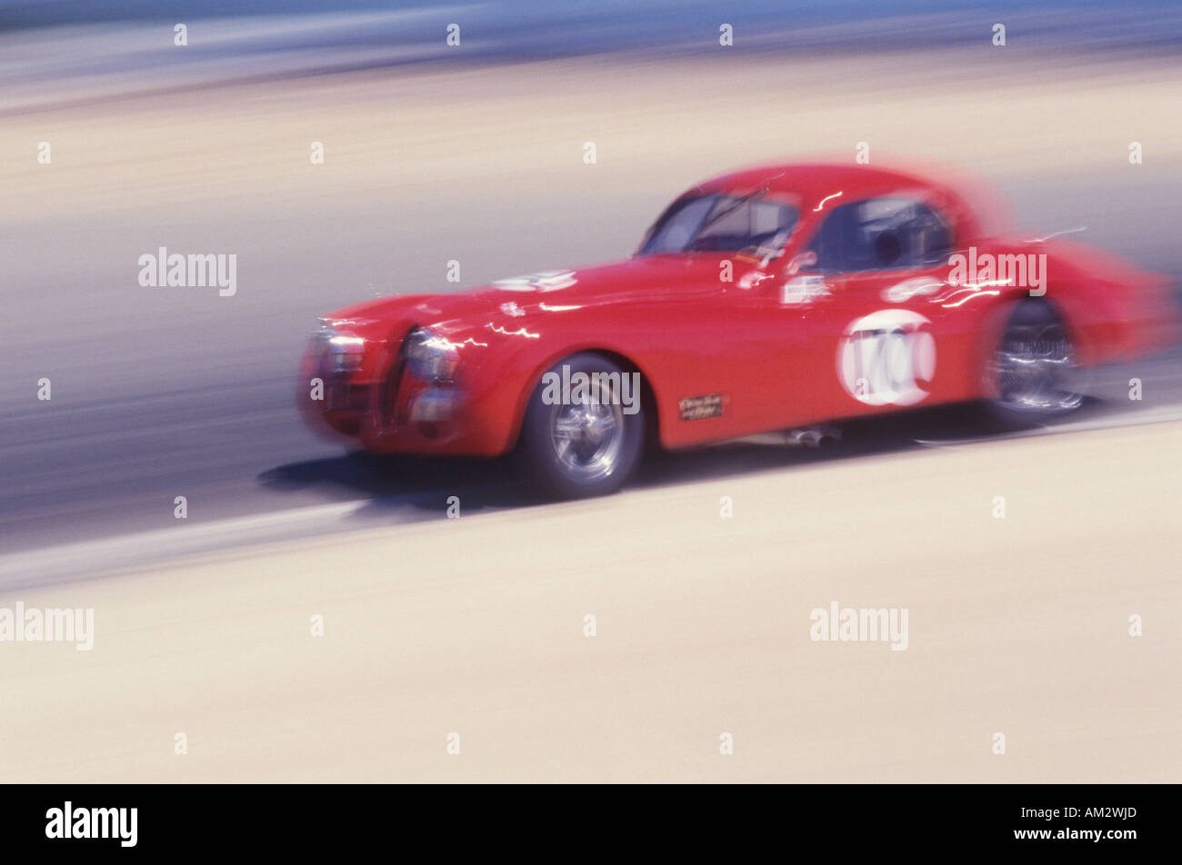 A red car in the Laguna Seca Classic Car Race in Carmel California Stock Photo