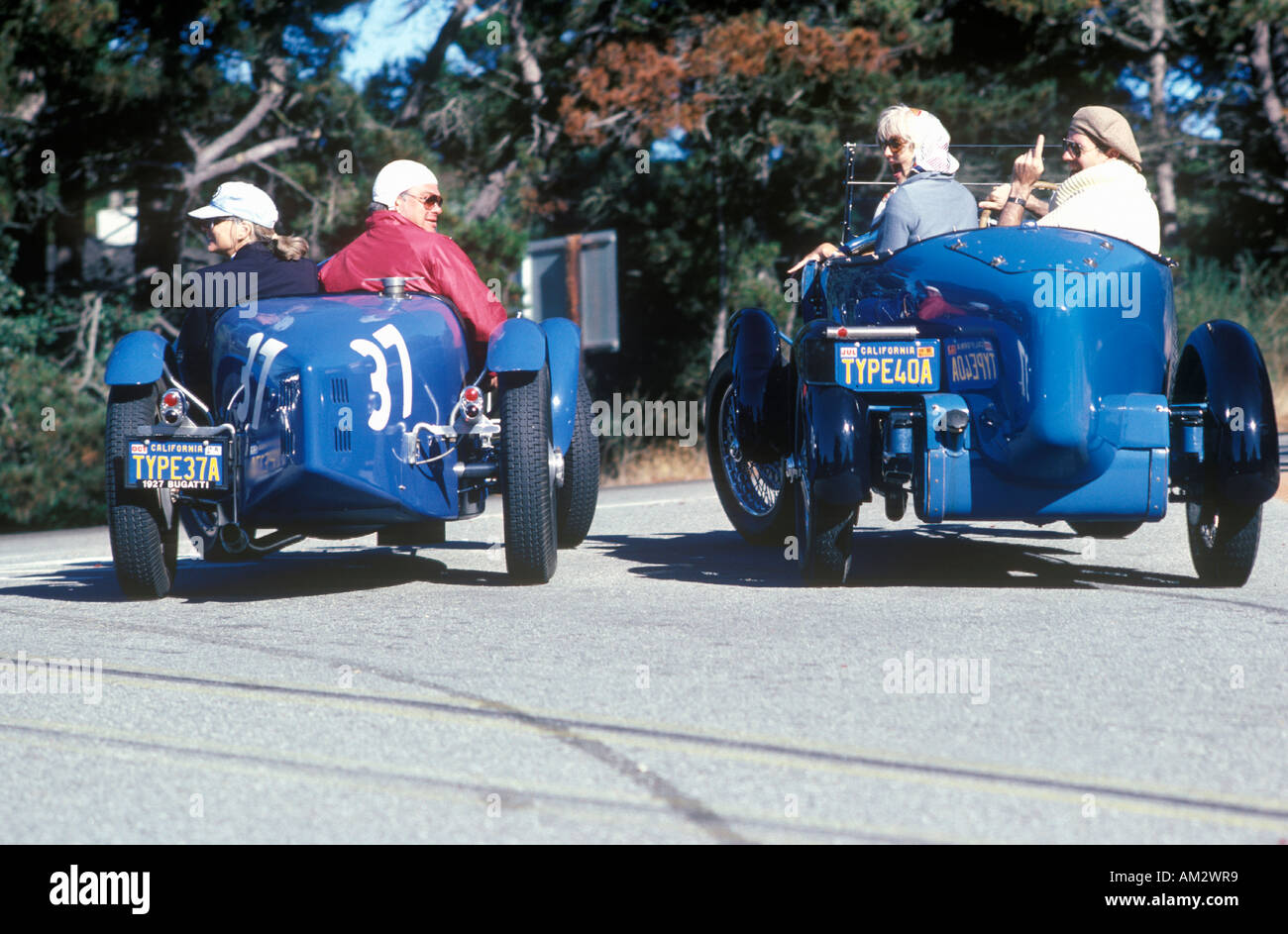 A group of Bugatti owners drive their classic cars down Route 1 during the 35th Pebble Beach Concours vintage car show ca 1985 Stock Photo