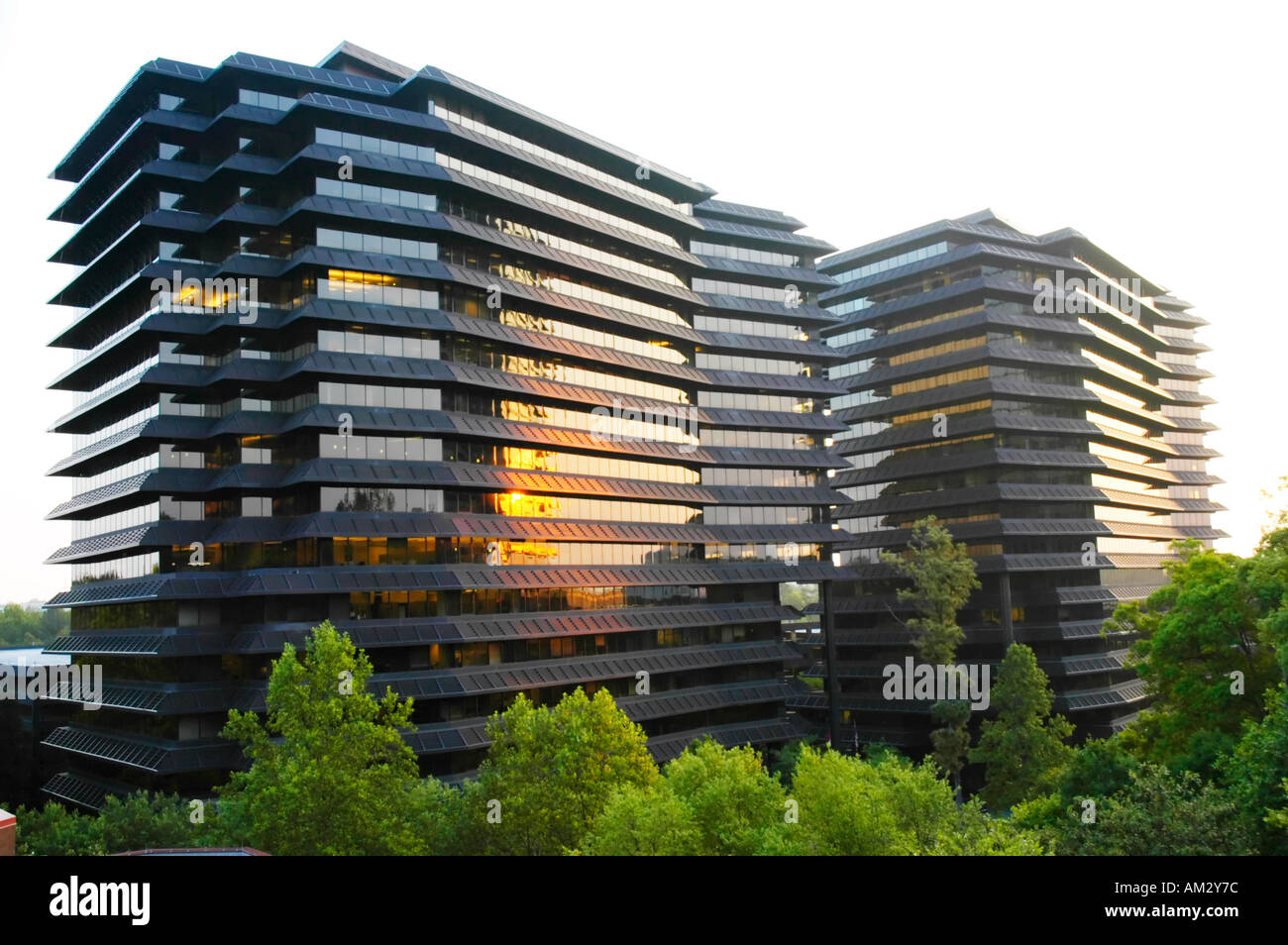 Sunrise on high rise office building Stock Photo - Alamy