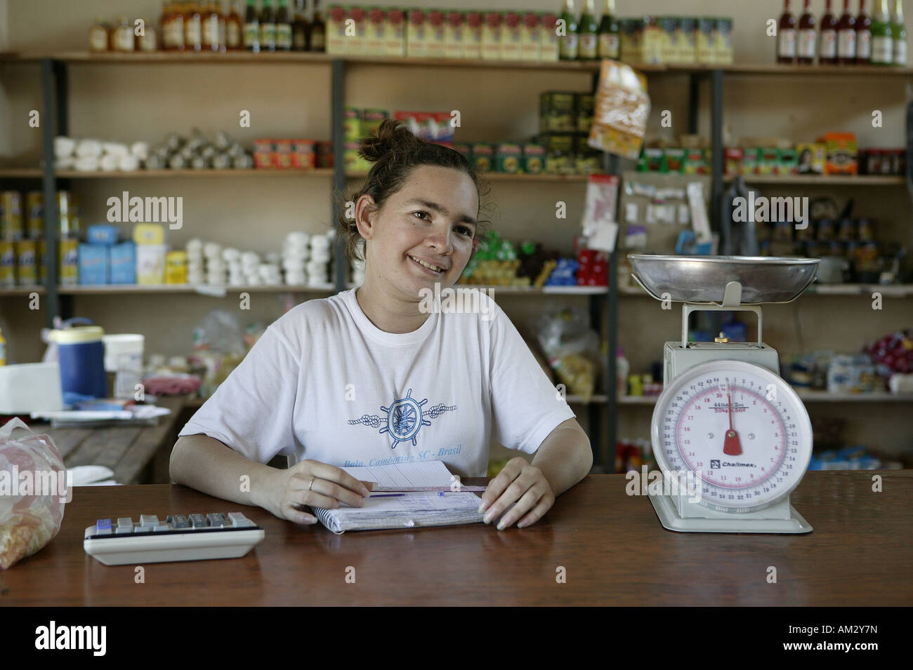 Sales assistant in shop, 'Comunidad 18 de Agosto', Paraguay, South America Stock Photo