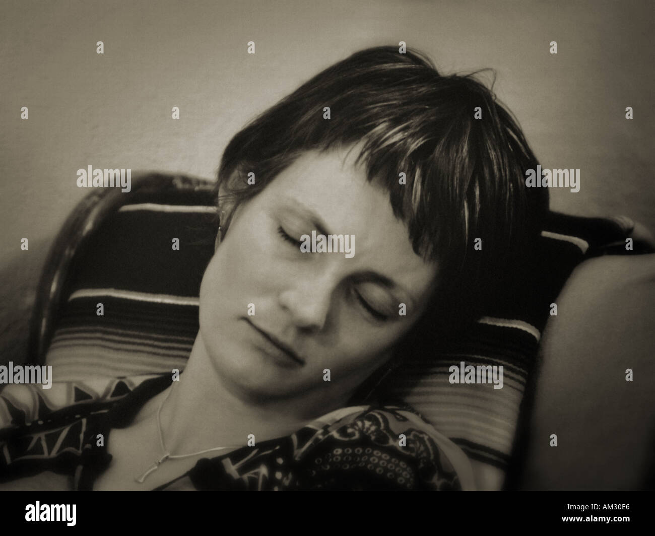 Sleeping Woman in chair Ireland Stock Photo
