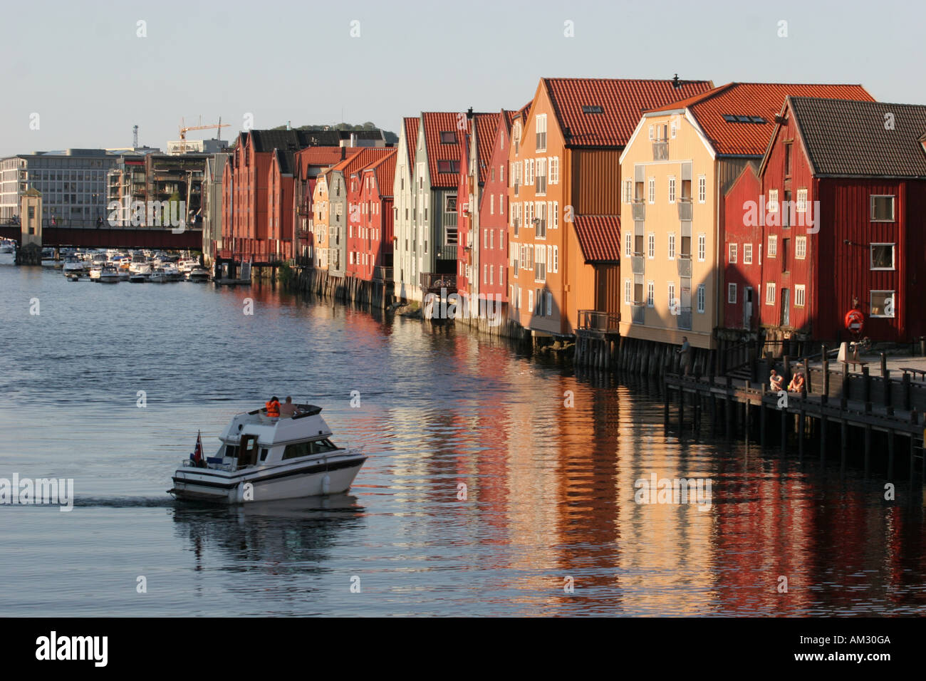 old wooden house trondheim Norway and a boat Stock Photo