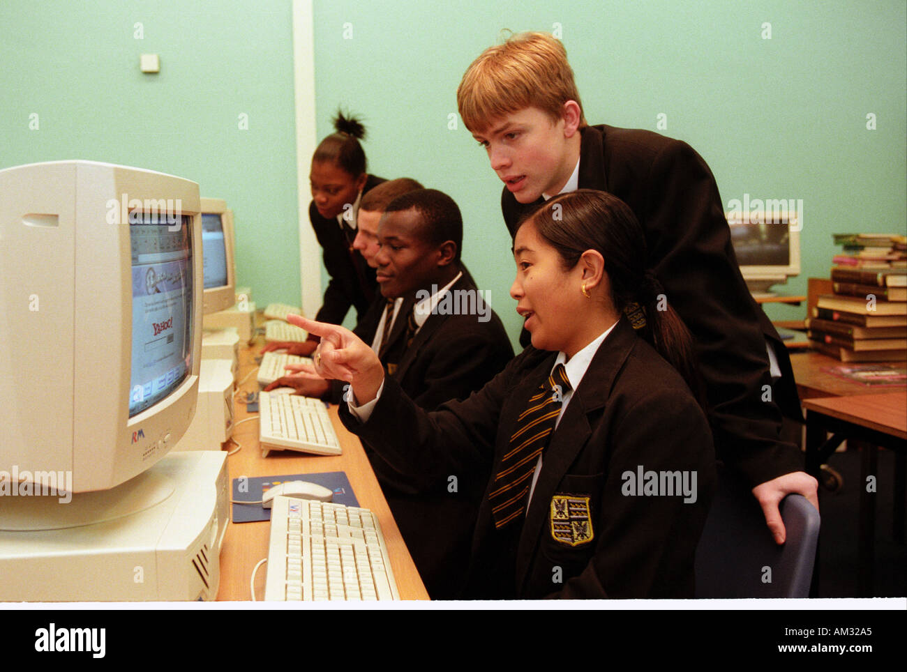 Secondary school pupils working on computers. Stock Photo