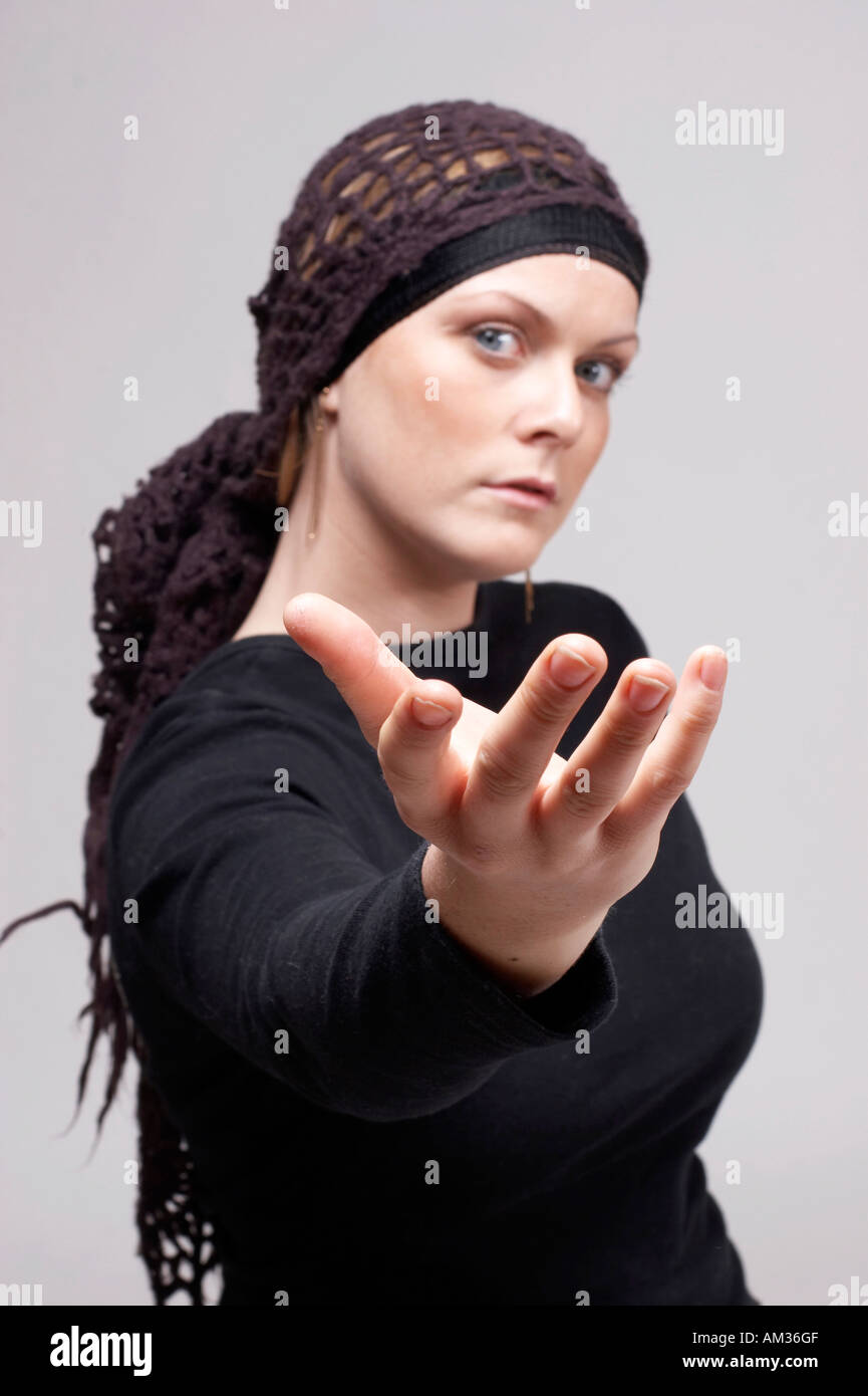 expressive girl with scarf  playing with her hand Stock Photo