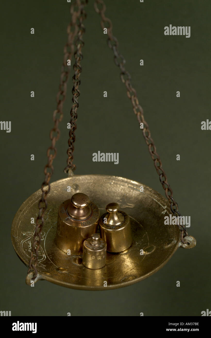 French copper weights on a scale Stock Photo - Alamy