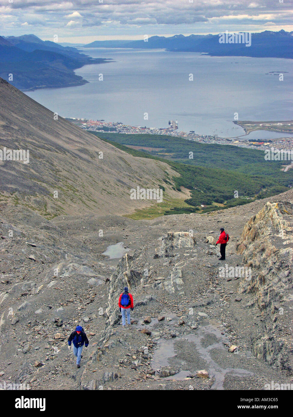 Hikers climb up to the Martial Glacier in the Martial Mountains above Ushuaia Argentina Beagle Channel Stock Photo