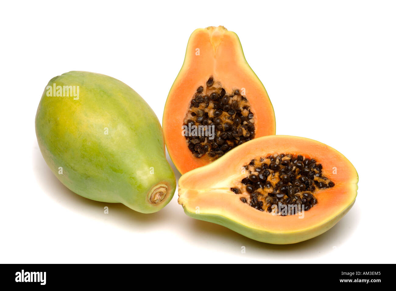 two papaya or paw paw with one halved to show flesh and seeds Stock Photo Alamy
