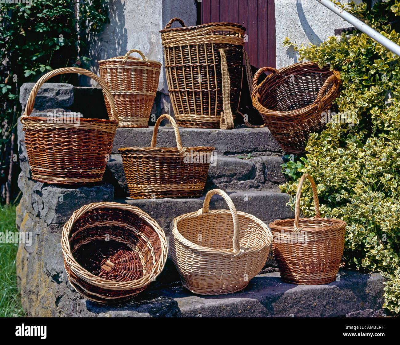 Various straw baskets on stairs Stock Photo Alamy
