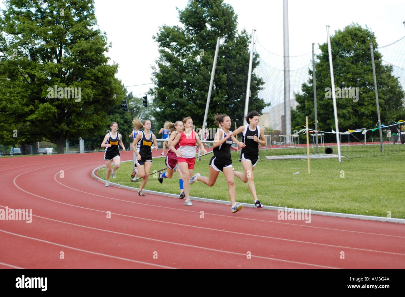 Teenage girl runners at a high school track and field district meet