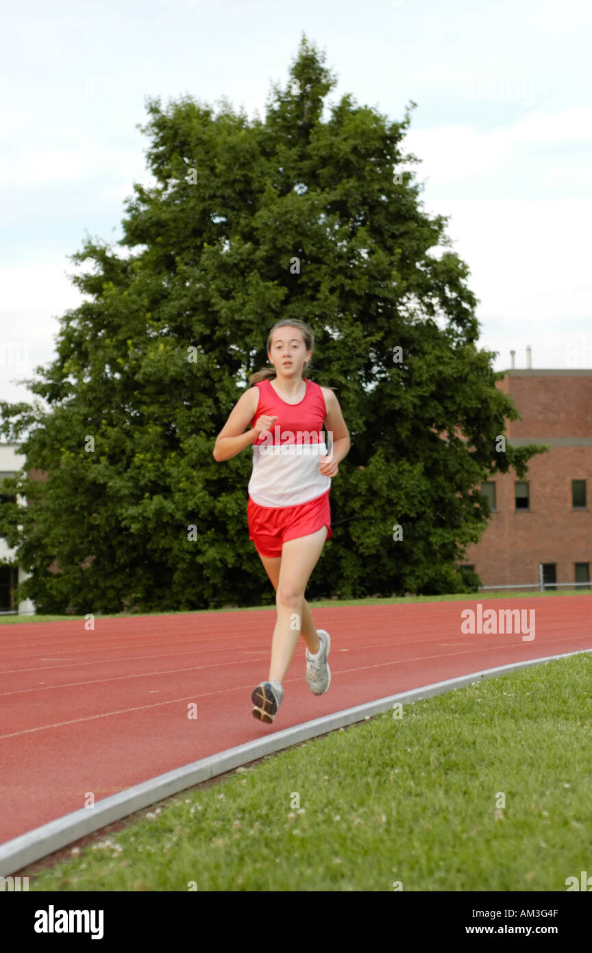 Teenage girl runners at a high school track and field district meet