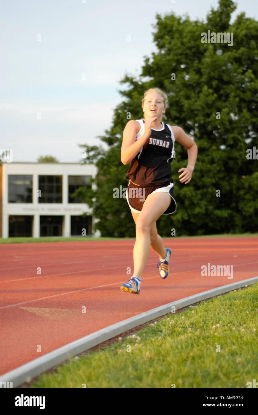 Female High School Track Runner Teaching Stock Photo 716692894