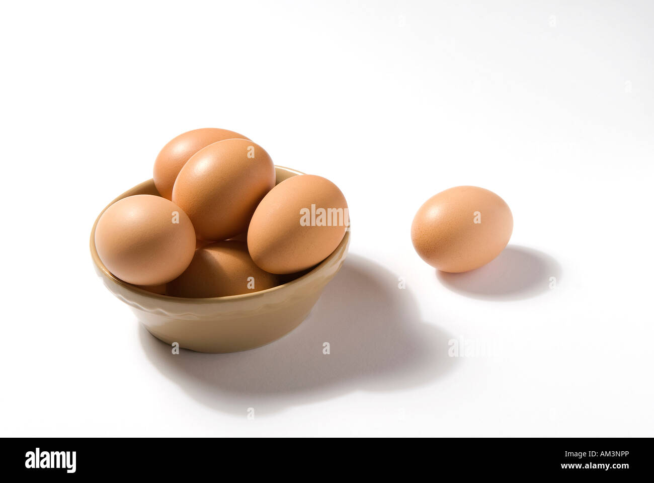 bowl of organic free range eggs on white background Stock Photo