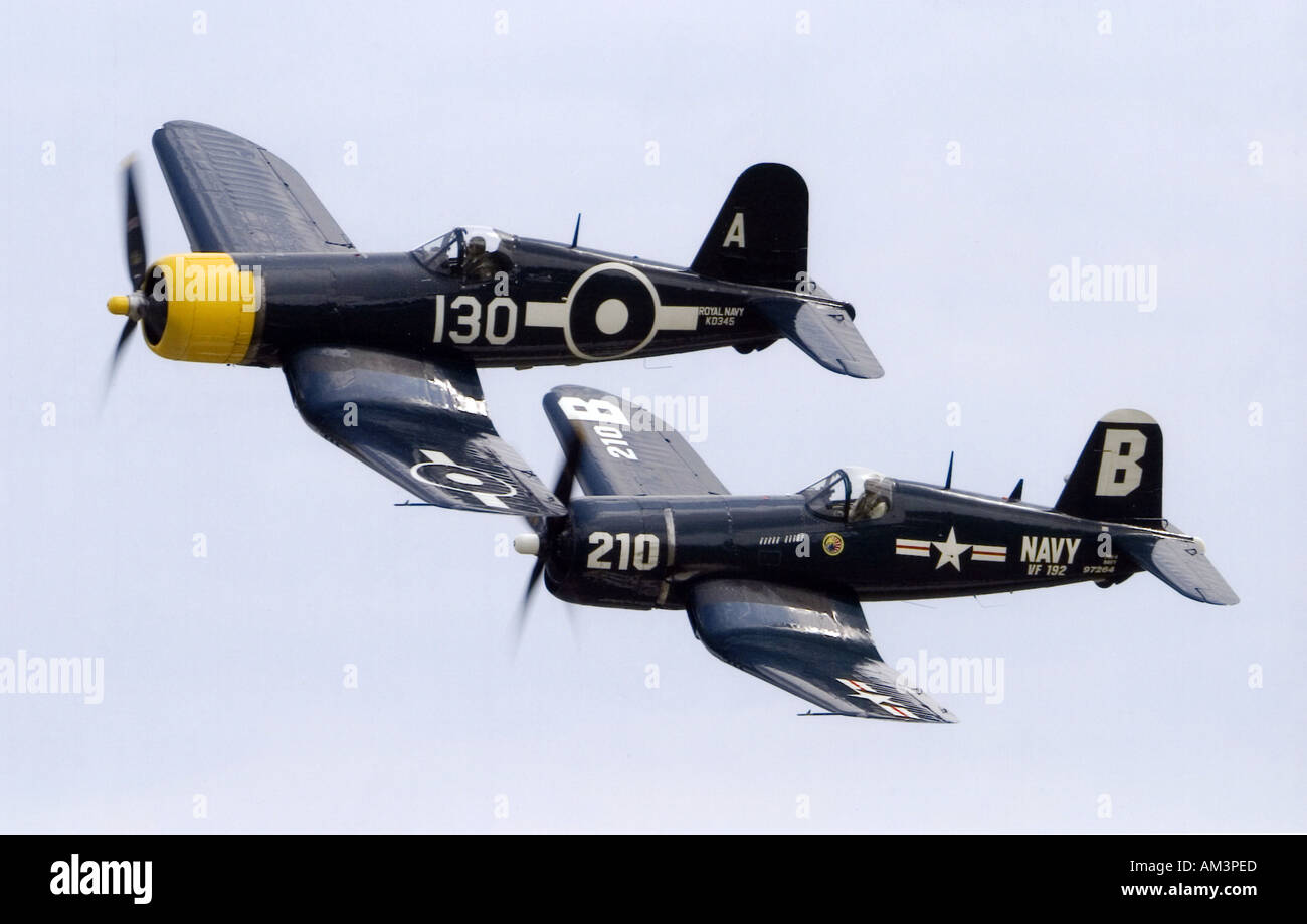 Goodyear FG 1D Corsair and CV F4U 4 Corsair formate for a flypast at Duxfords Flying Legends Show Stock Photo