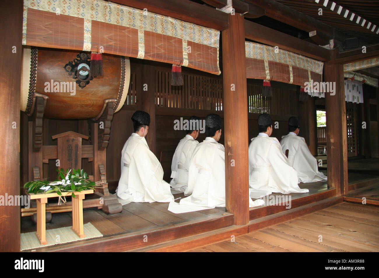 Shinto priests pray during a harvest festival ceremony at a shrine Japan Stock Photo