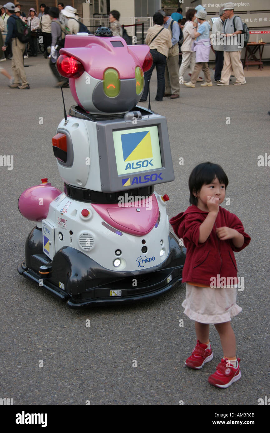 Young girl with a robot at the World Expo 2005 in Japan Stock Photo
