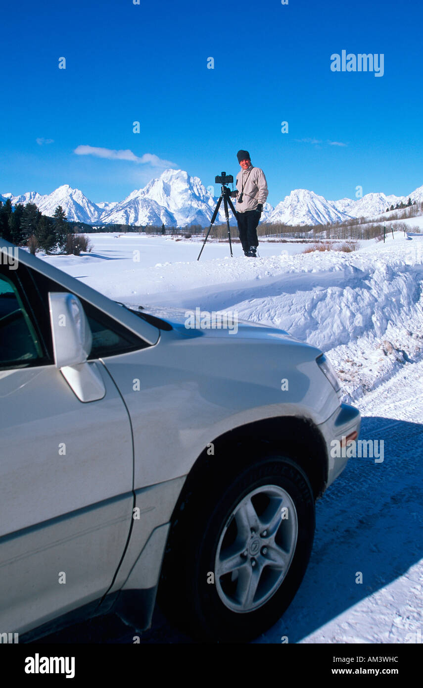 Photographer Joe Sohm posing with Lexus RX300 and panoramic camera ready to take picture in Jackson Hole Wyoming in the Grand Stock Photo