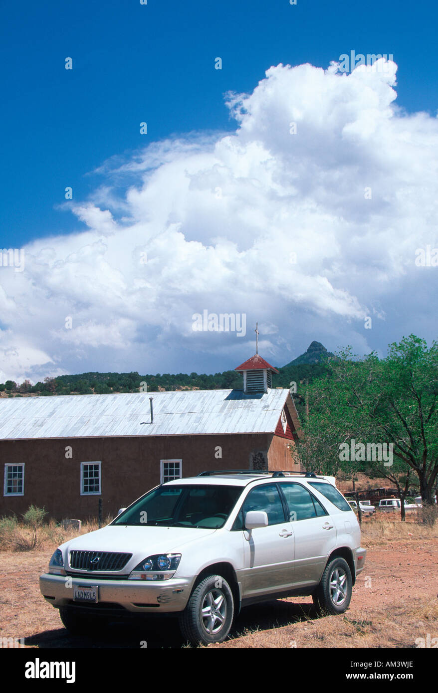 Joe Sohm stopping Lexus RX300 in front of old Church in New Mexico Stock Photo
