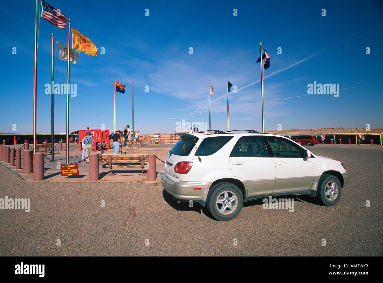 Joe Sohm parking Lexus RX300 in front of 4 Corners Monument for New Mexico Arizona Utah and Colorado Stock Photo