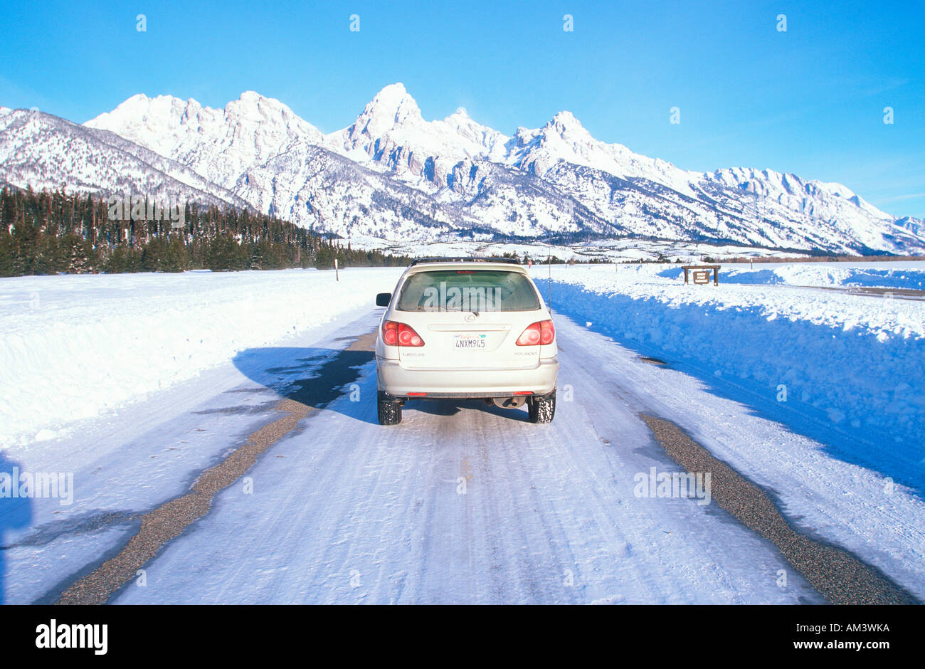 Joe Sohm s Lexus RX300 navigating snowy road in Grand Teton National Park Jackson Hole Wyoming Stock Photo