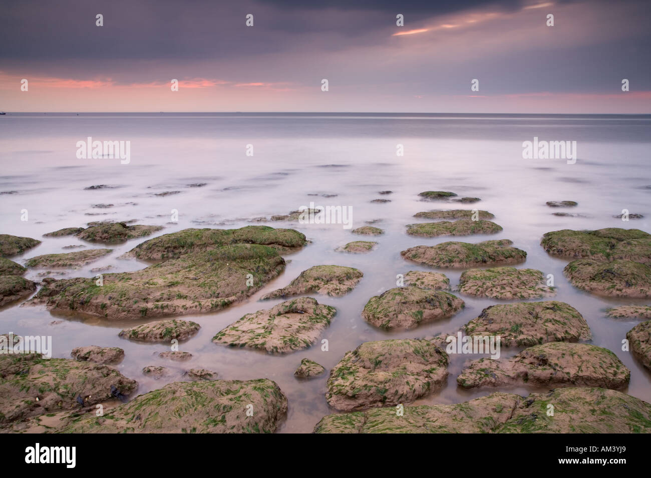 Sunset & the incoming tide, Hunstanton, North Norfolk, UK Stock Photo