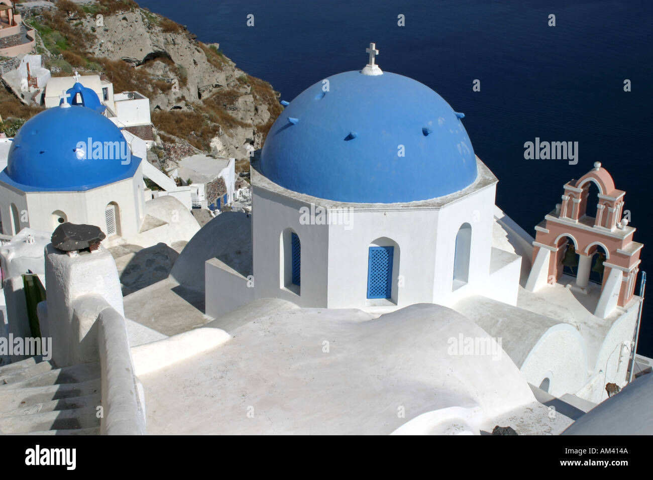 Typical blue domed church roofs on popular tourist destination Greek island of Santorini Greece