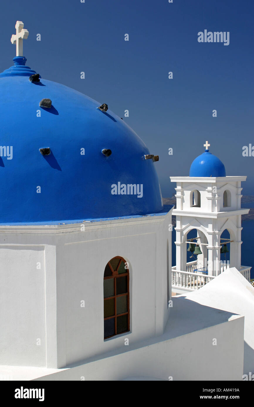 Classic blue domed church roof overlooking the Agean sea on famous Santorini island volcano