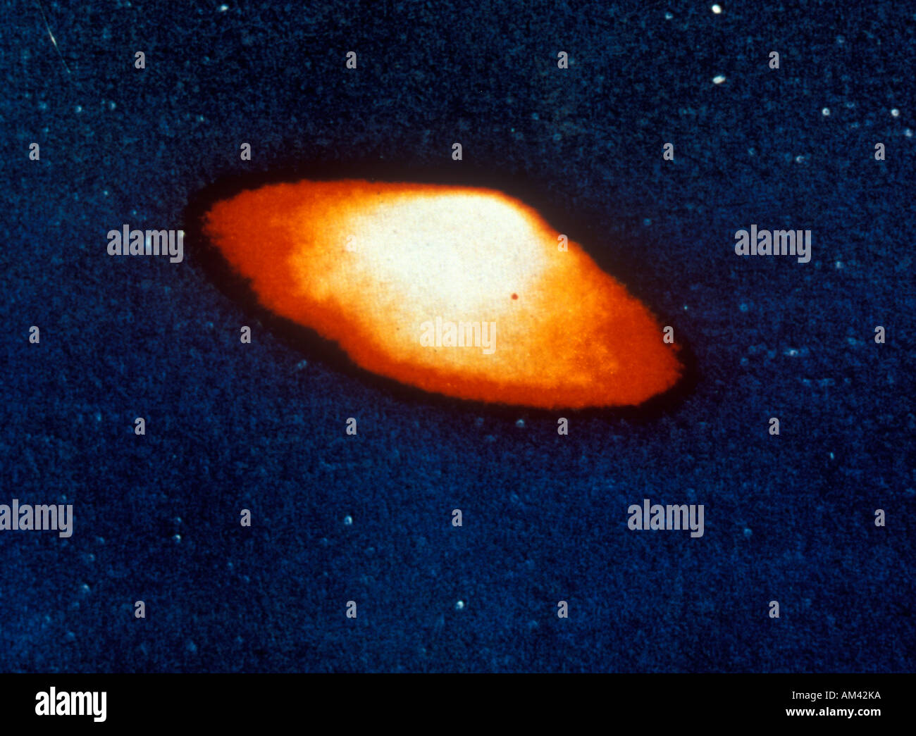A UFO traveling through a starry sky Stock Photo