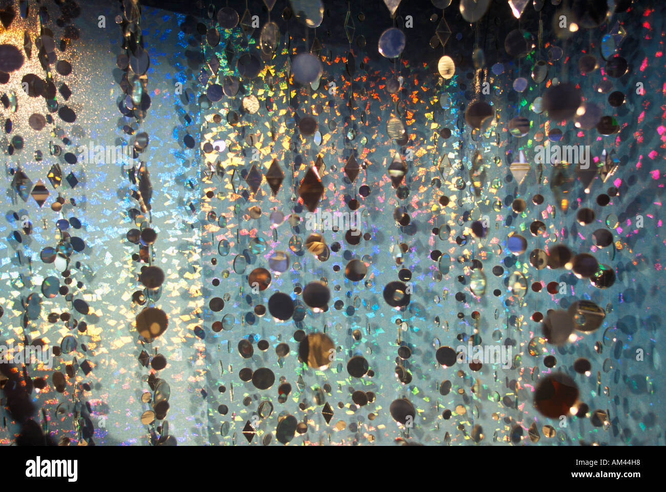 Multicolored glowing crystals hanging in strands Stock Photo