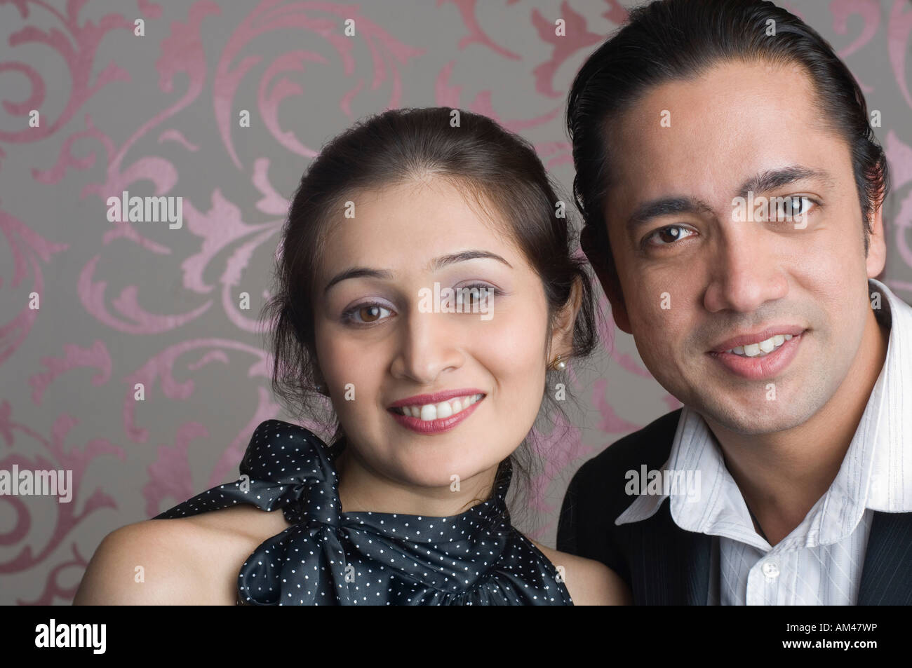 Portrait of a mid adult man smiling with a young woman Stock Photo - Alamy