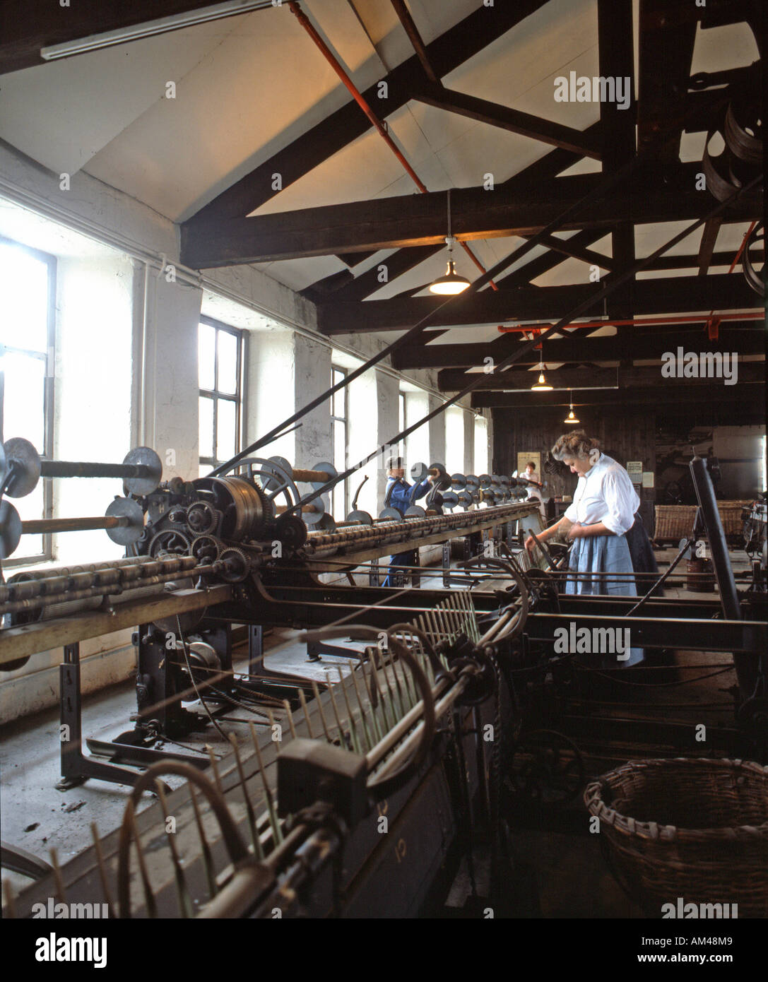 Weaving machines built during the Industrial Revolution, on display and working at Armley Mills, Leeds Industrial Museum. Stock Photo