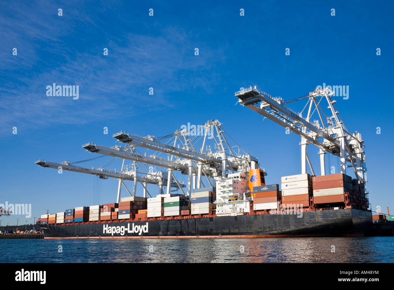 Cranes and dock at port of Seattle with container ship Stock Photo - Alamy