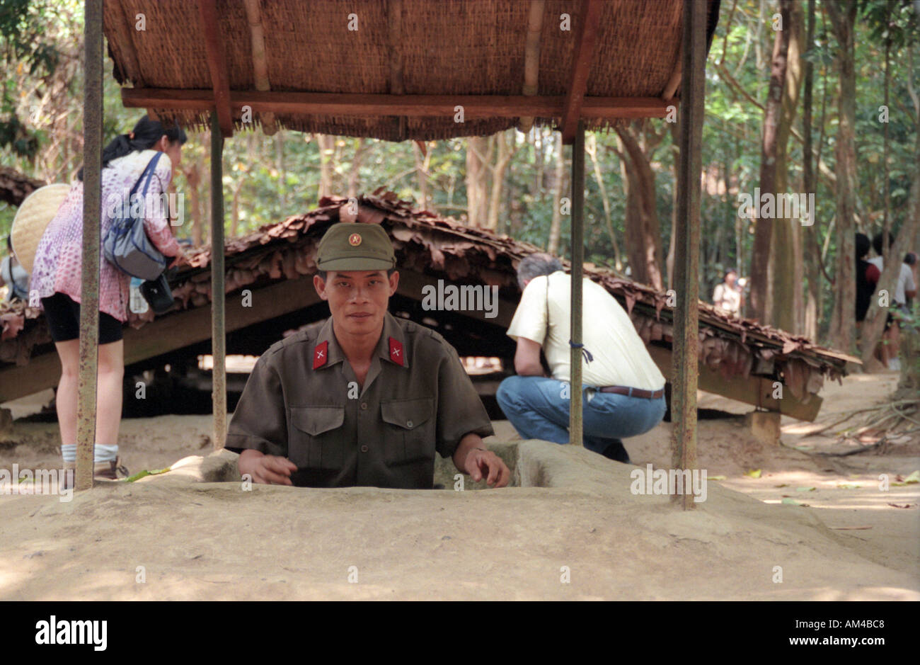 Vietnamese soldier coming out of one of the Cu Chi Tunnels in Ho Chi Minh City Vietnam  Stock Photo