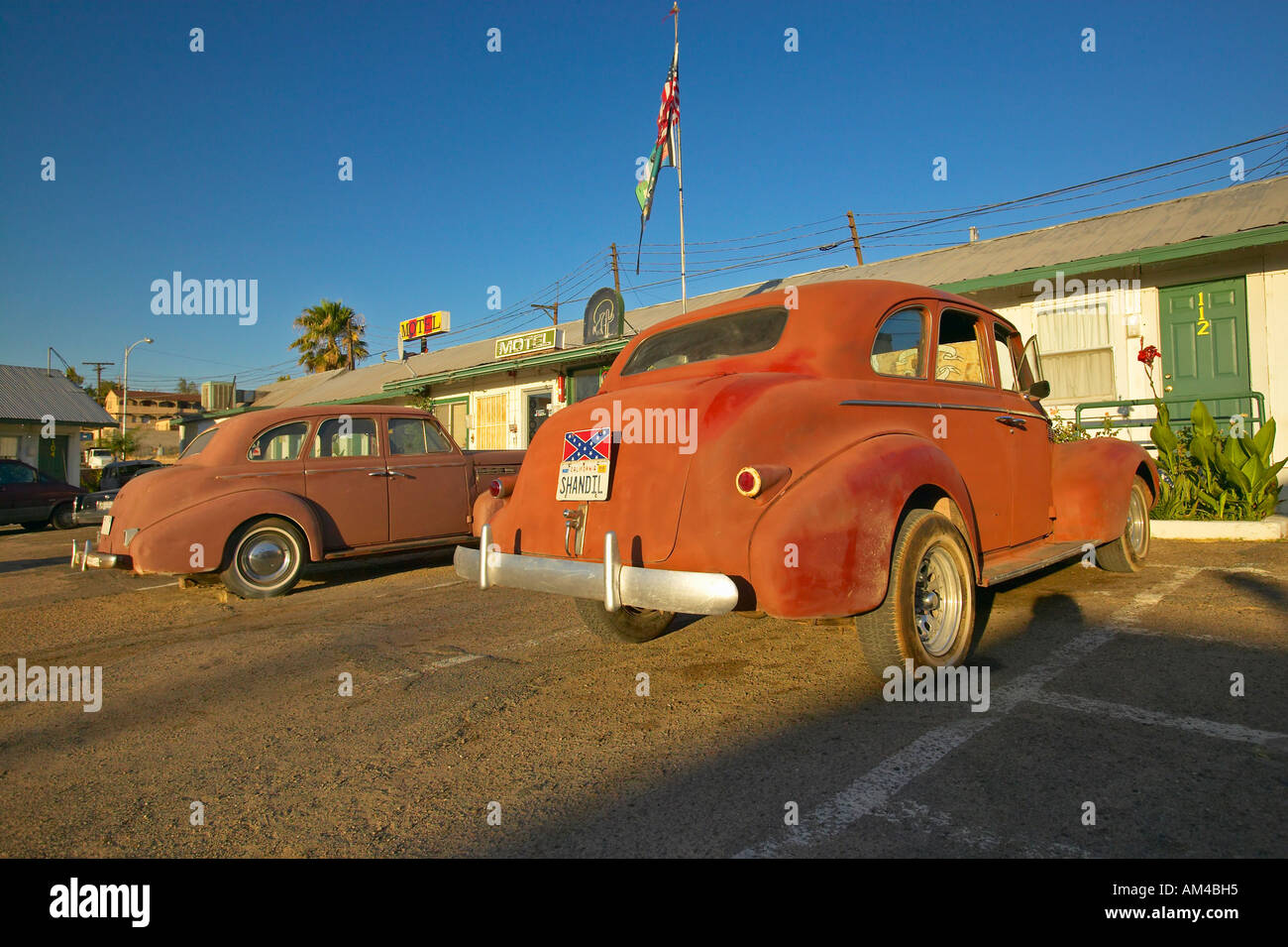 Historic vintage roadside motel on old Route 66 welcomes old cars and guests in Barstow California Stock Photo
