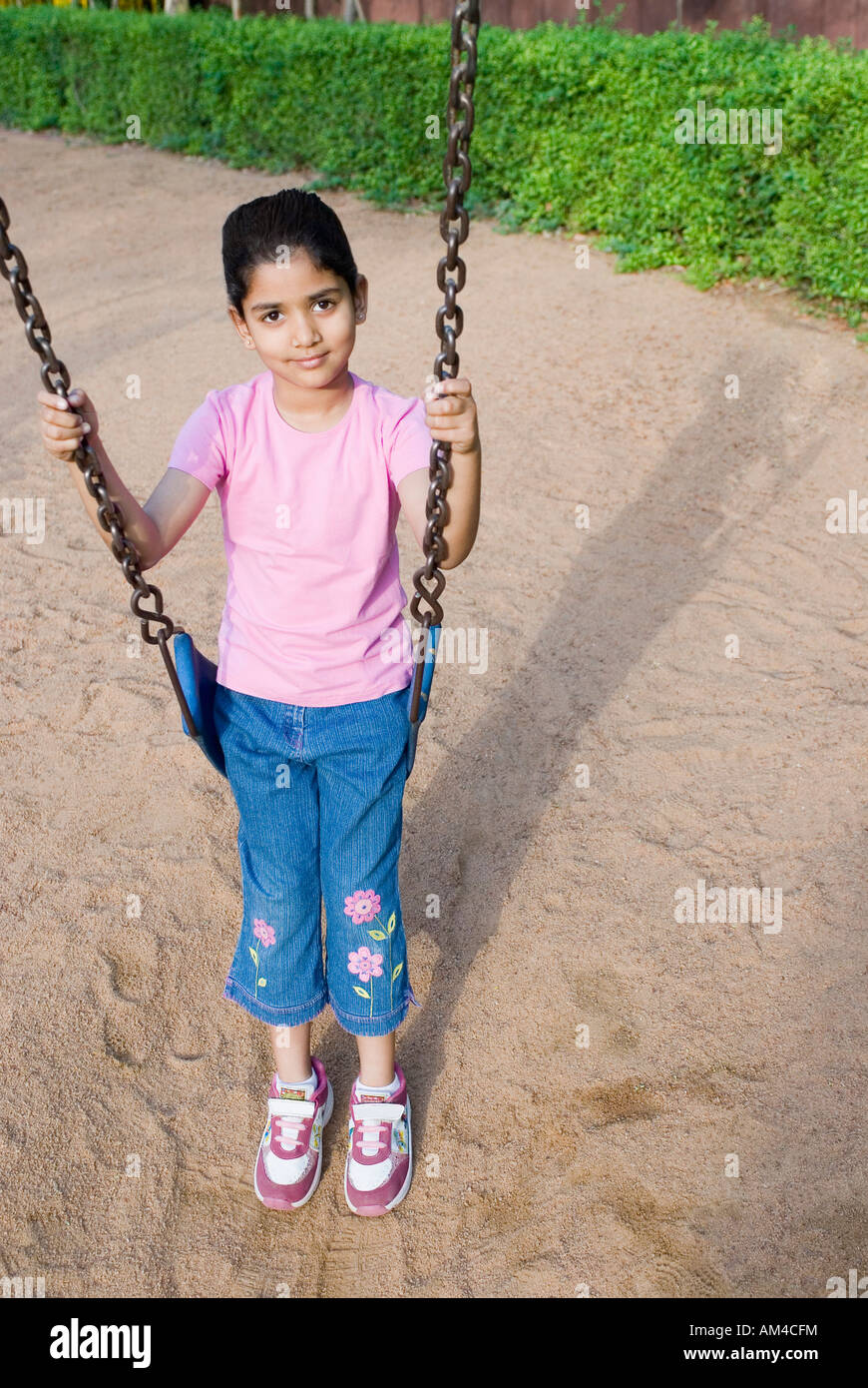 Indian girl sitting on swing hi-res stock photography and images - Alamy