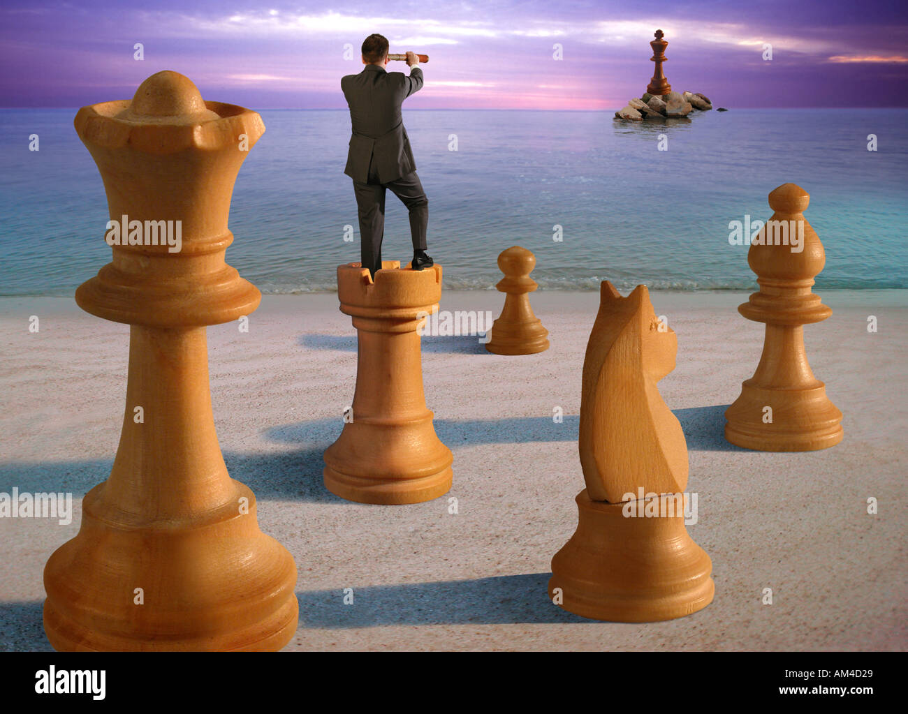 A man stands atop a chess pice and surveys the enemy with a telescope in a business metaphor image Stock Photo