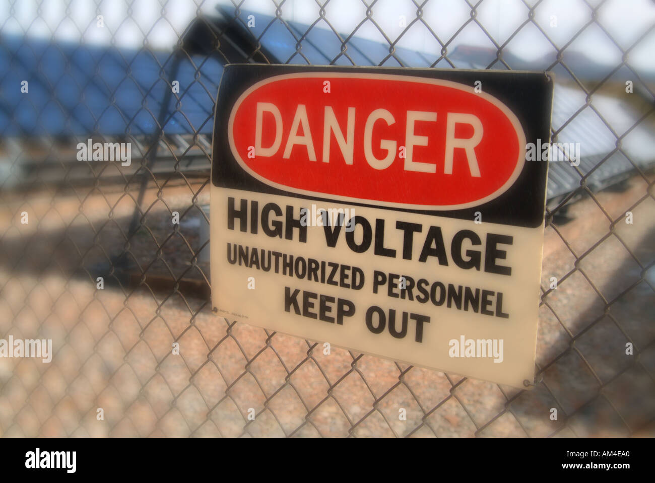 danger sign outside a fenced high voltage area Stock Photo