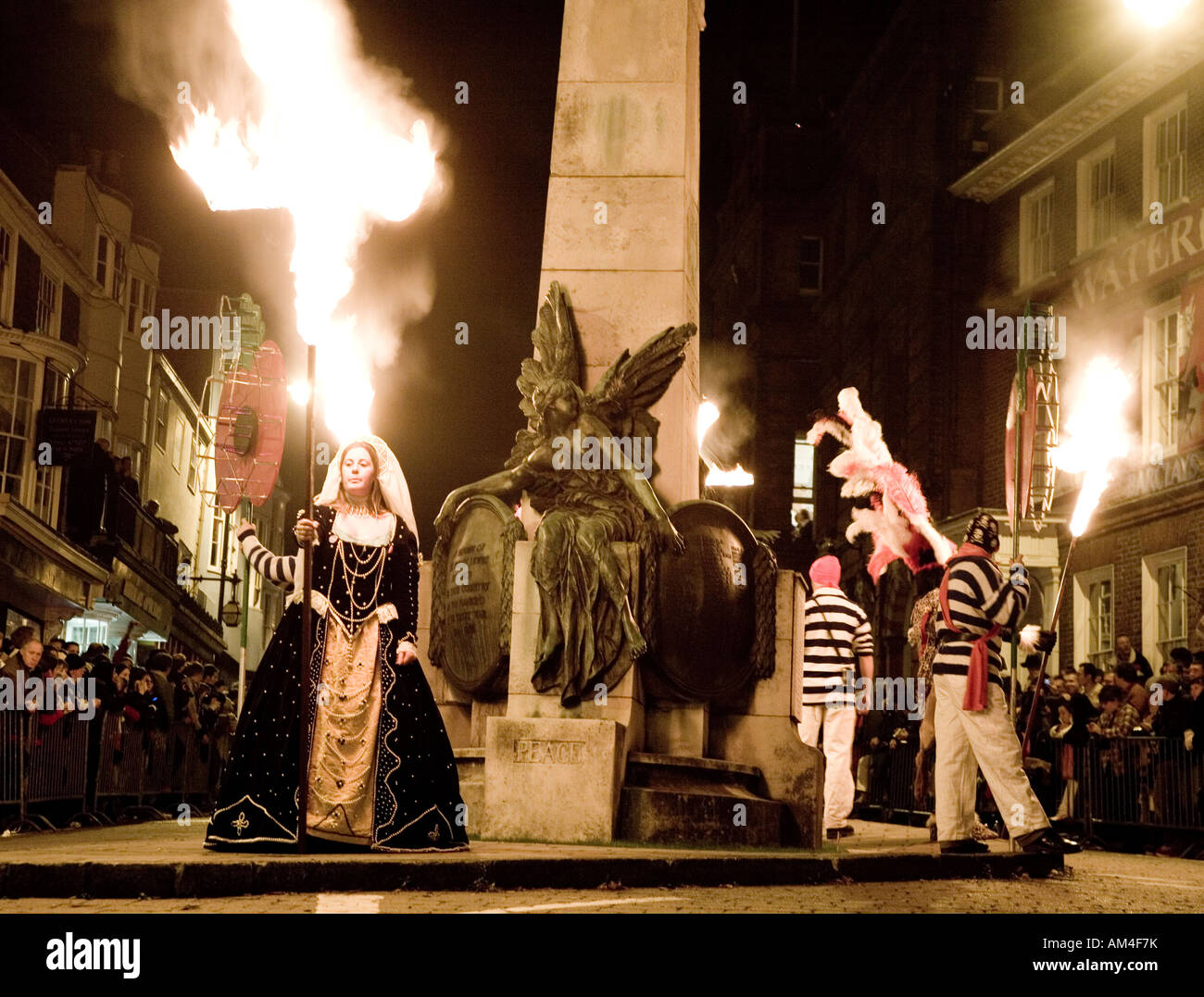 Victorian Dressed Women By The Memorial At The Lewes Fire Festival Sussex UK Europe Stock Photo