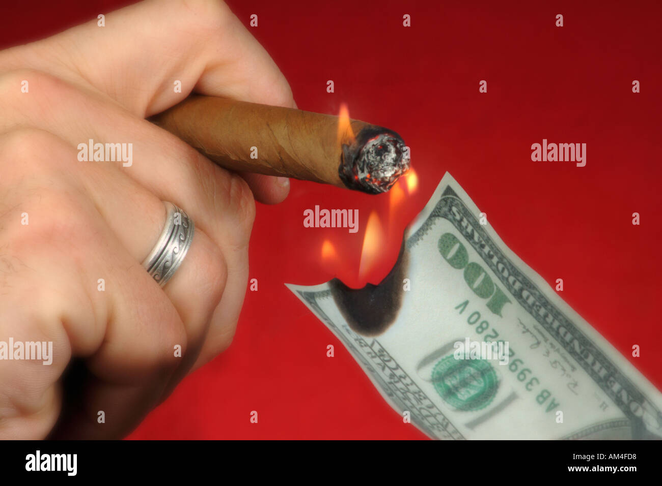 Burning cigar rich hires stock photography and images Alamy