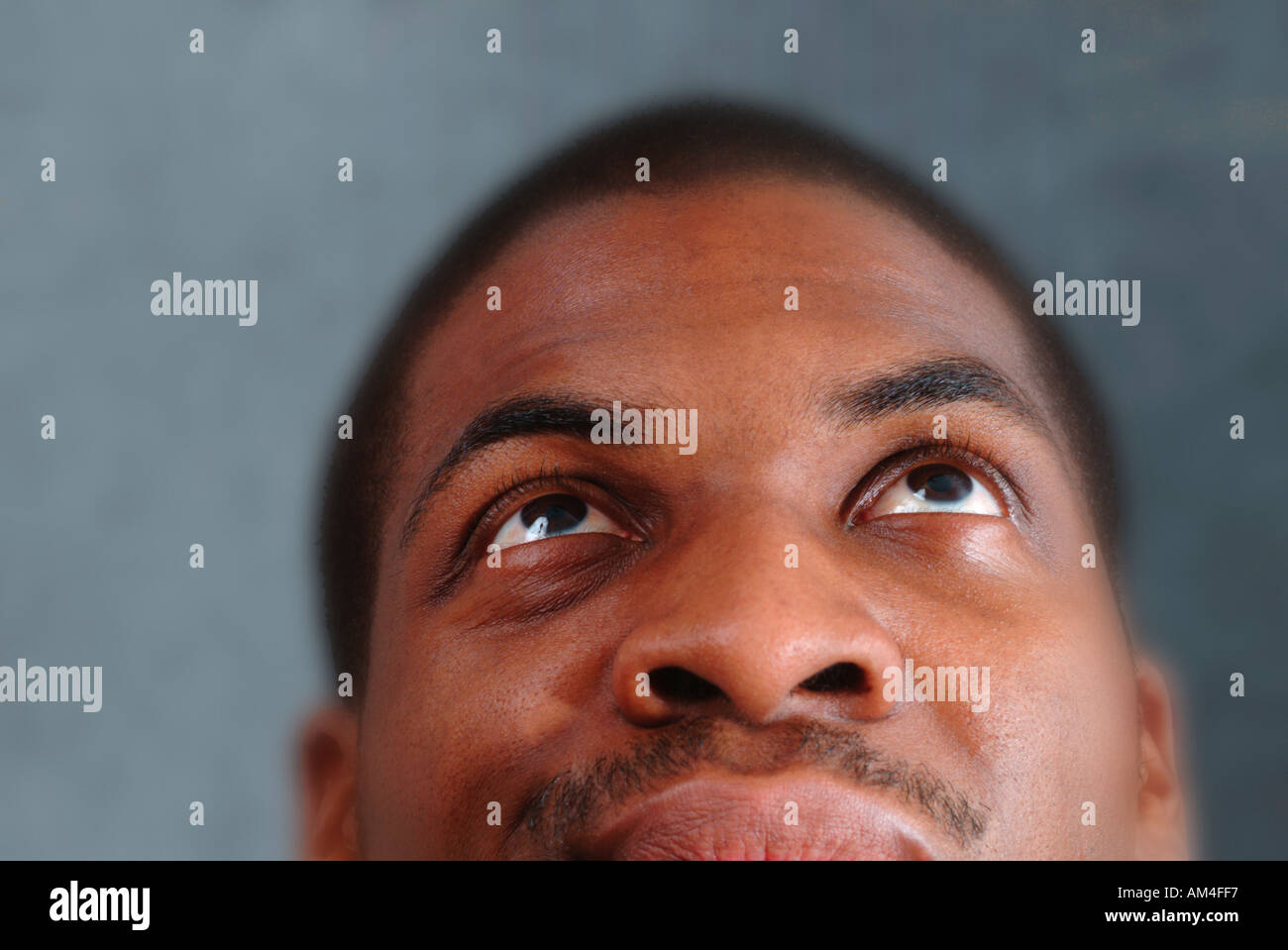 African American face looking up up-close and cropped Stock Photo - Alamy