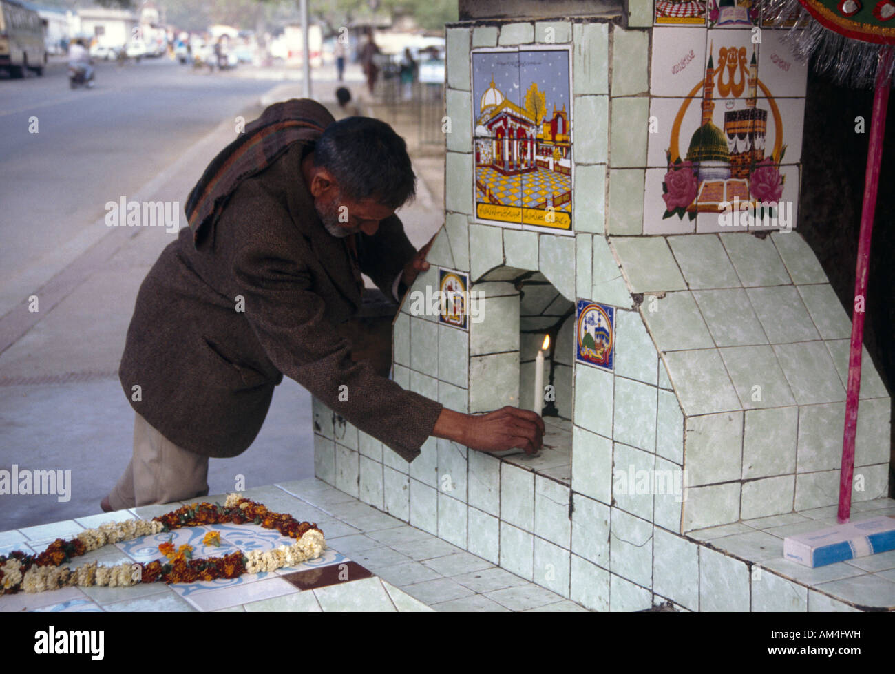 Delhi India Lighting Candle In Shrine In Street Stock Photo Alamy