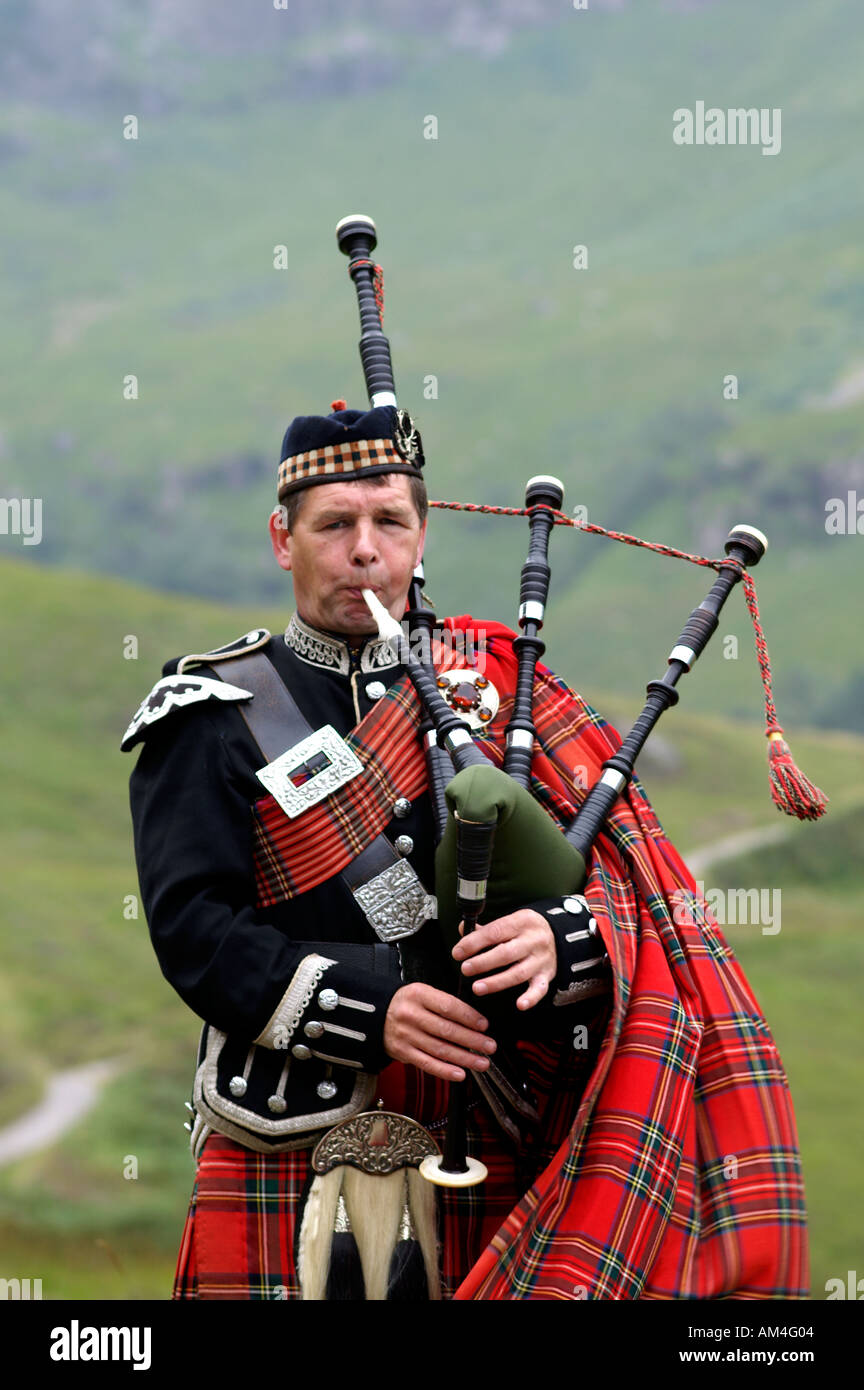 Scottish piper playing pipes Scotland Stock Photo Alamy